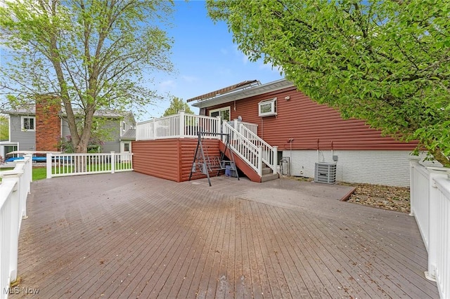 back of house featuring a deck, central AC, and stairs