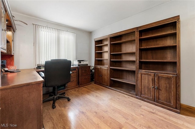 office with light wood-style flooring