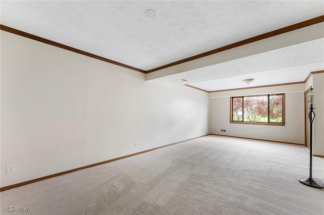 spare room with crown molding, baseboards, and light carpet
