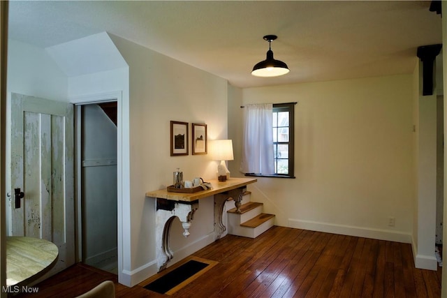 office space with baseboards and hardwood / wood-style flooring