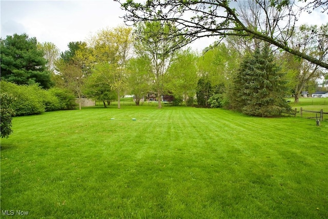 view of yard featuring fence