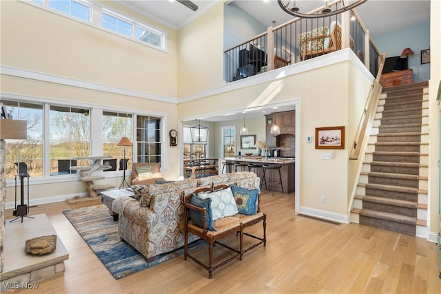 46748 New London Eastern Rd, New London, OH 44851 - living area with stairs, baseboards, and light wood-style floors
