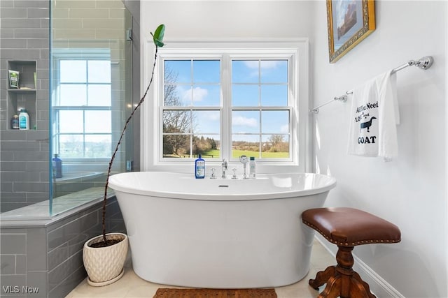 46748 New London Eastern Rd, New London, OH 44851 - full bath with a freestanding tub and tile patterned flooring