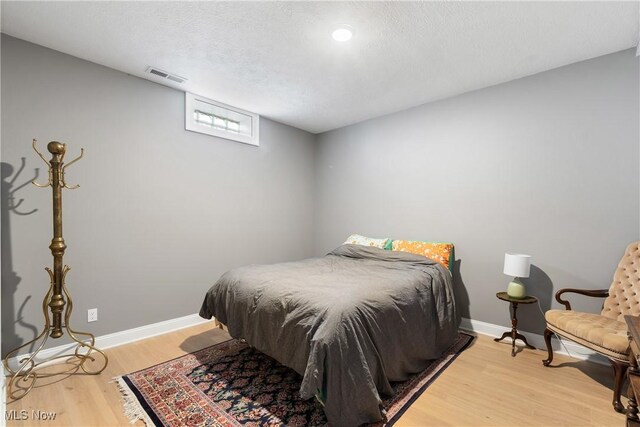 46748 New London Eastern Rd, New London, OH 44851 - bedroom featuring light wood-style floors, baseboards, and visible vents