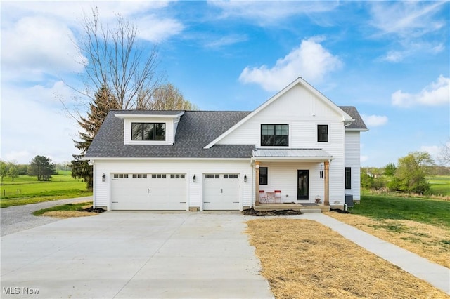 46748 New London Eastern Rd, New London, OH 44851 - modern farmhouse style home featuring a shingled roof, an attached garage, a porch, a front yard, and concrete driveway
