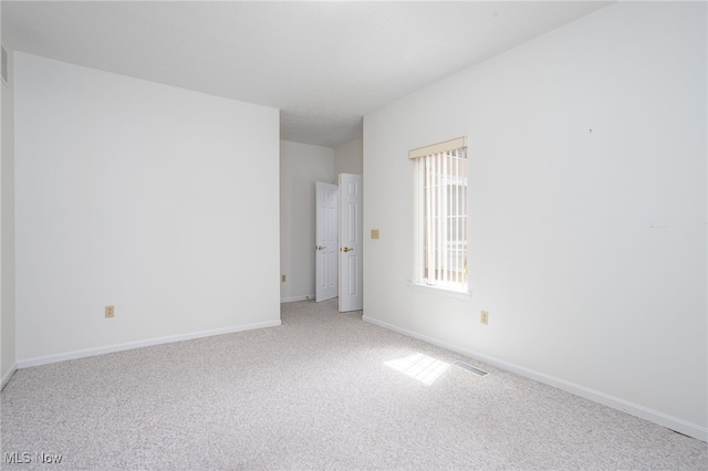 11235 Frederick Ln, Twinsburg, OH 44087 - carpeted spare room with baseboards and visible vents
