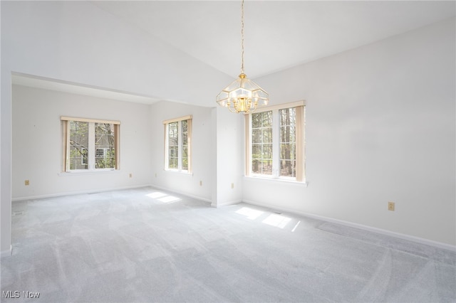 11235 Frederick Ln, Twinsburg, OH 44087 - carpeted spare room featuring baseboards, a notable chandelier, and vaulted ceiling