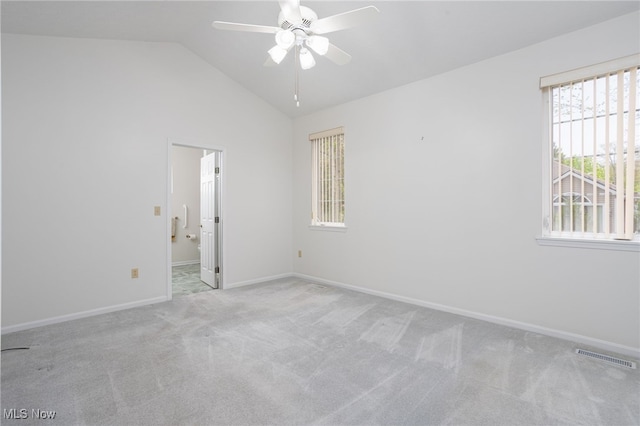 11235 Frederick Ln, Twinsburg, OH 44087 - carpeted empty room featuring a ceiling fan, baseboards, visible vents, and vaulted ceiling