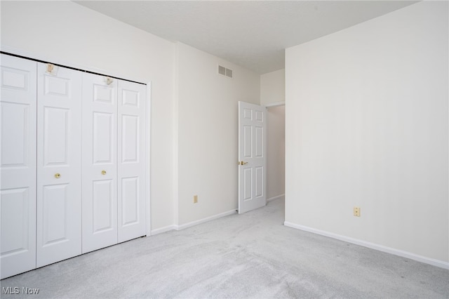 11235 Frederick Ln, Twinsburg, OH 44087 - unfurnished bedroom featuring a closet, carpet flooring, baseboards, and visible vents