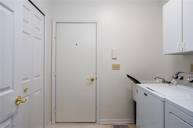 11235 Frederick Ln, Twinsburg, OH 44087 - laundry area with baseboards, separate washer and dryer, and cabinet space
