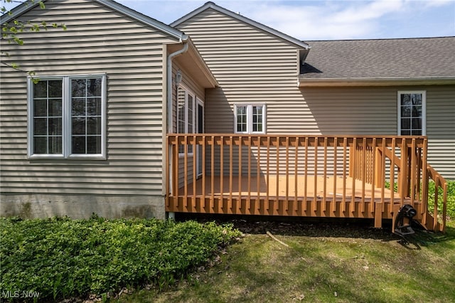 11235 Frederick Ln, Twinsburg, OH 44087 - back of property with a lawn, a shingled roof, and a deck