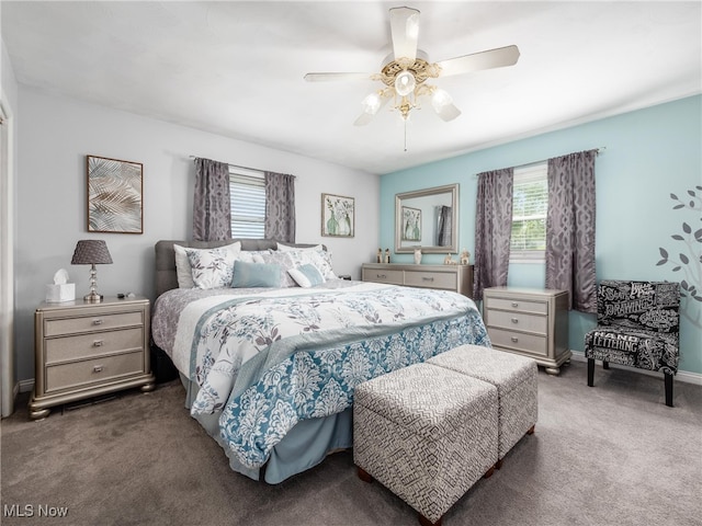 bedroom featuring ceiling fan and carpet