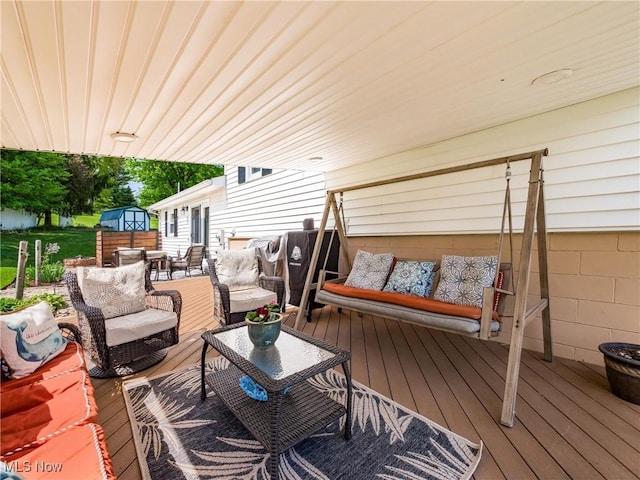 deck with an outdoor hangout area