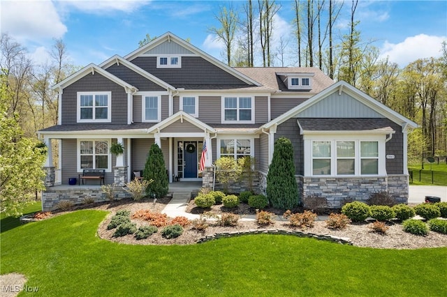 7965 Mcfarland Rdg, Chagrin Falls, OH 44023 - craftsman inspired home with a shingled roof, a porch, a front lawn, and stone siding