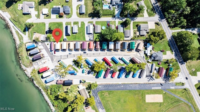 birds eye view of property with a water view