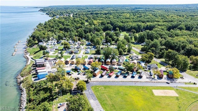 aerial view featuring a view of trees and a water view