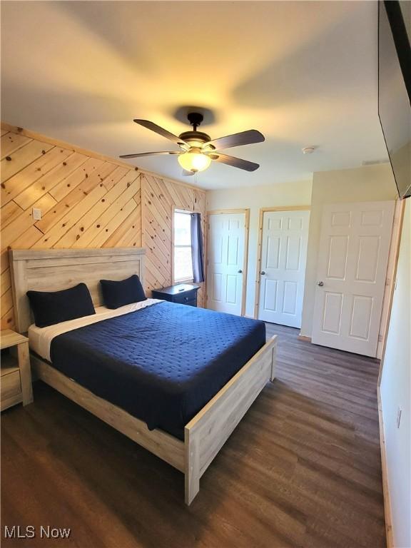 bedroom featuring ceiling fan and dark wood-type flooring