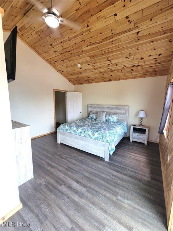 bedroom featuring baseboards, wood finished floors, vaulted ceiling, and wooden ceiling