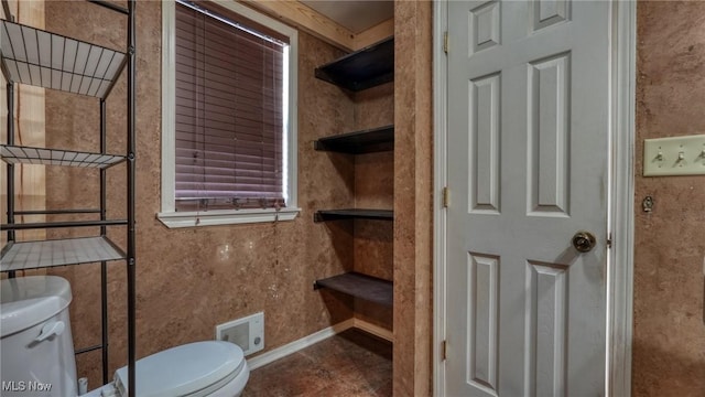 bathroom with toilet and visible vents