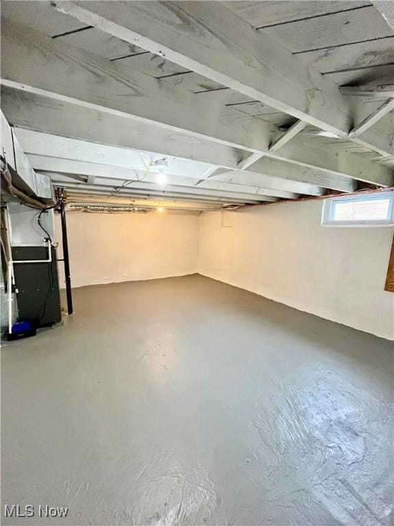 below grade area featuring heating unit