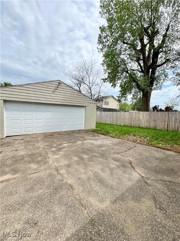 detached garage with fence