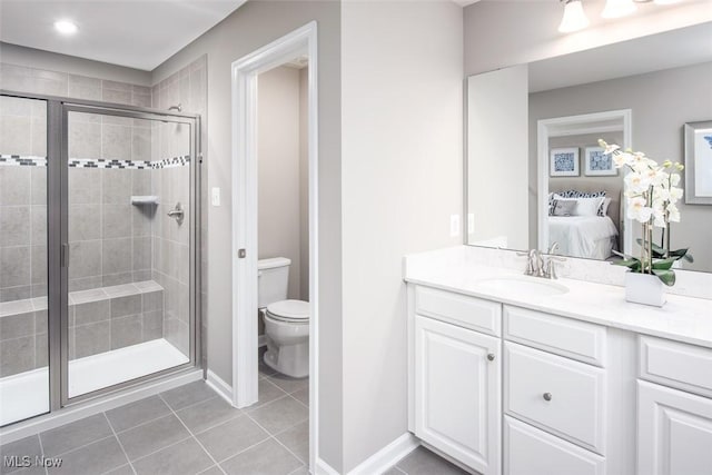 1030 Ashford Ct, Columbia Station, OH 44028 - ensuite bathroom featuring vanity, ensuite bath, toilet, tile patterned floors, and a stall shower