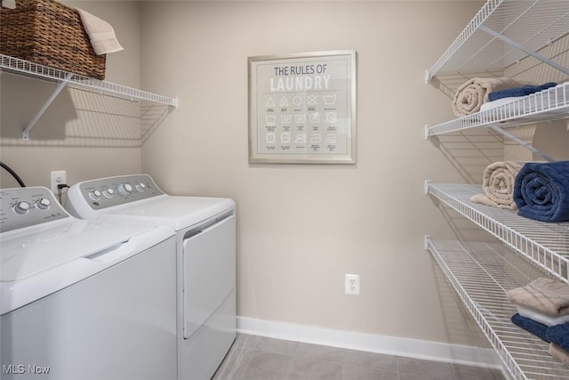 1030 Ashford Ct, Columbia Station, OH 44028 - clothes washing area with laundry area, tile patterned floors, baseboards, and washing machine and dryer