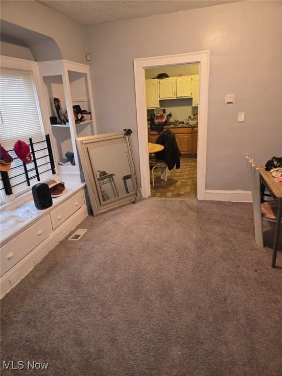 bedroom with visible vents and baseboards