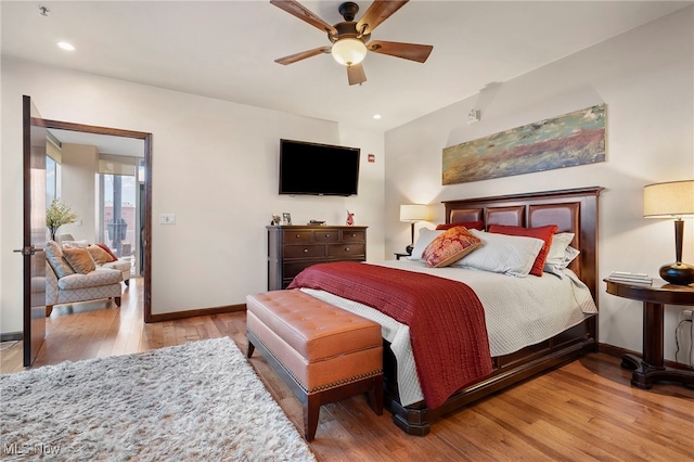 bedroom featuring recessed lighting, baseboards, ceiling fan, and hardwood / wood-style flooring