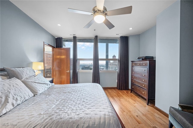 bedroom featuring a ceiling fan, baseboards, recessed lighting, and light wood-type flooring