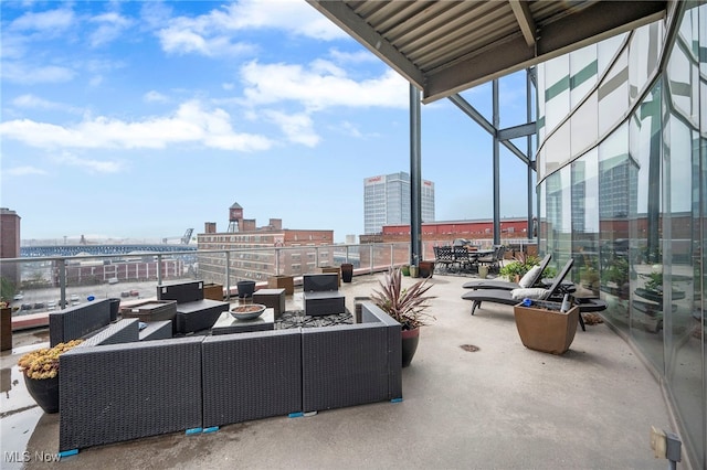 view of patio / terrace with an outdoor hangout area and a view of city