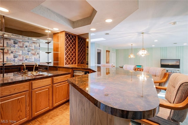 1175 Inverness Ln, Stow, OH 44224 - bar with hanging light fixtures, a sink, indoor wet bar, recessed lighting, and wallpapered walls