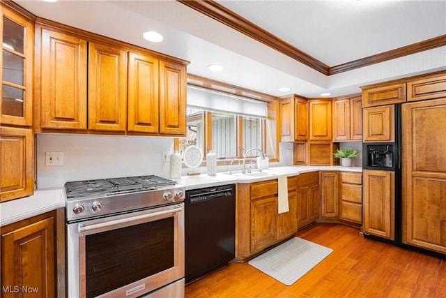 1175 Inverness Ln, Stow, OH 44224 - kitchen with stainless steel range with gas stovetop, ornamental molding, brown cabinetry, and black dishwasher