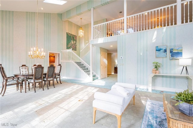 1175 Inverness Ln, Stow, OH 44224 - interior space with a towering ceiling, stairway, a notable chandelier, carpet, and wallpapered walls