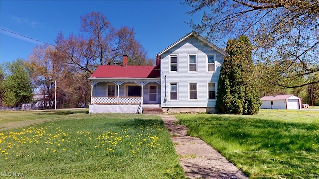 view of front of home with a porch, a chimney, and a front yard