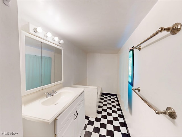 bathroom with tile patterned floors and vanity
