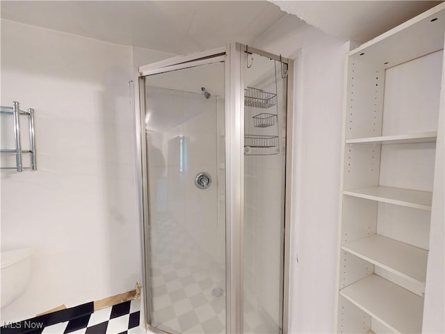 full bath with tile patterned floors and a stall shower