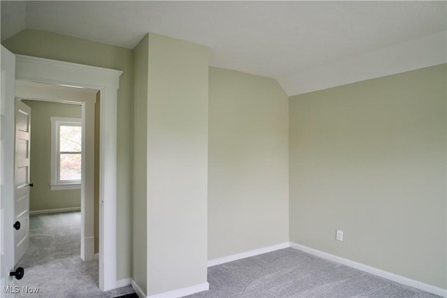 918 Pitkin Ave, Akron, OH 44310 - carpeted empty room with baseboards and lofted ceiling