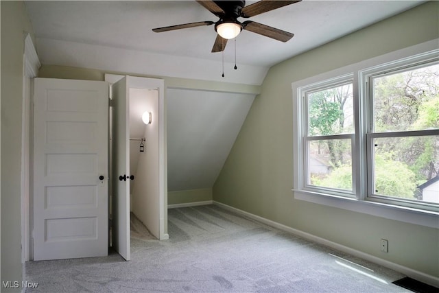 918 Pitkin Ave, Akron, OH 44310 - unfurnished bedroom with visible vents, baseboards, ceiling fan, carpet, and vaulted ceiling