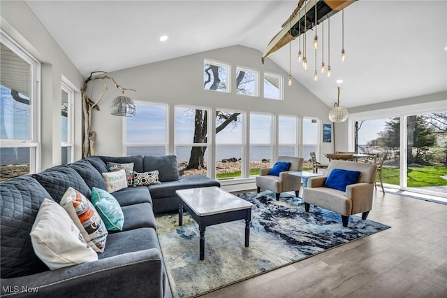 sunroom / solarium featuring a water view