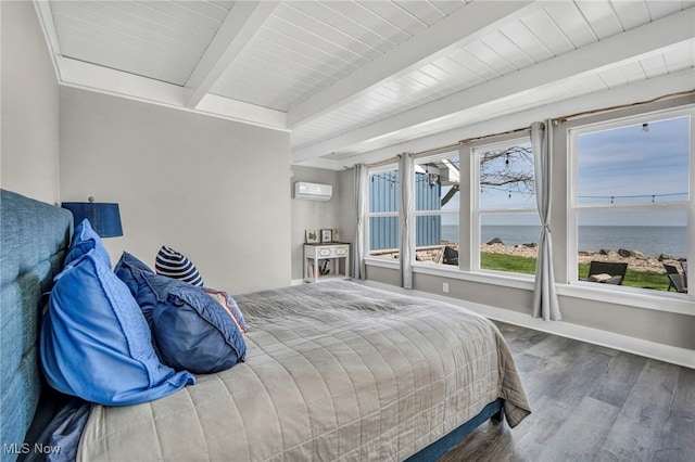 bedroom featuring wood finished floors, baseboards, beamed ceiling, an AC wall unit, and a water view