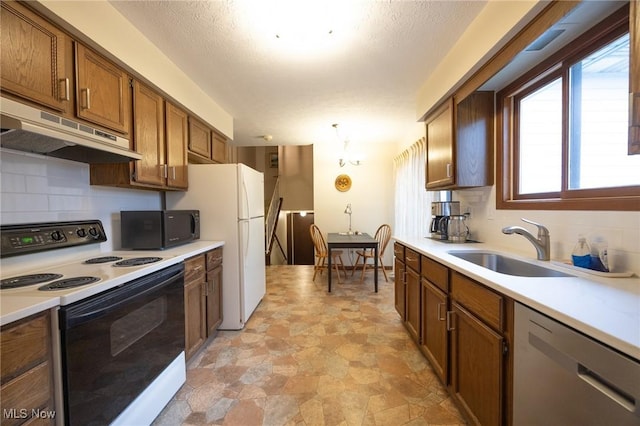 kitchen featuring black microwave, electric range oven, dishwasher, a sink, and under cabinet range hood
