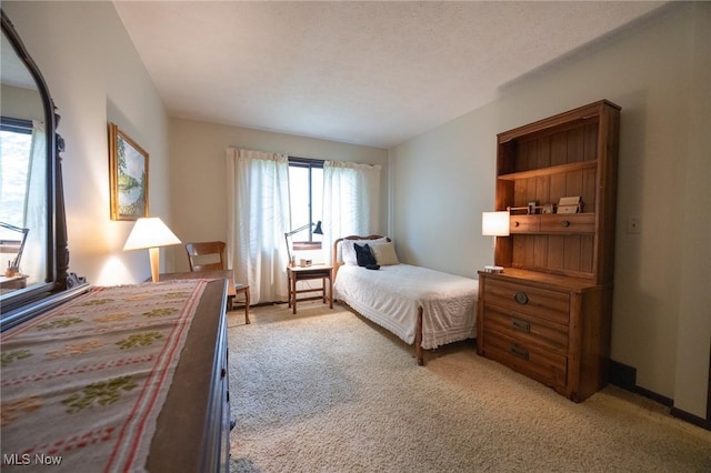 bedroom with light colored carpet