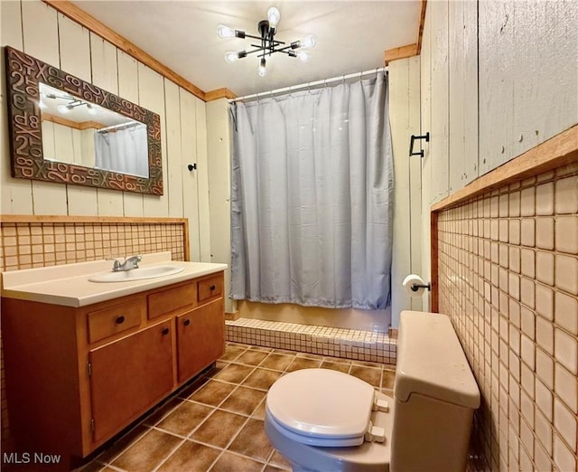 bathroom featuring toilet, shower / bath combination with curtain, tile patterned flooring, and vanity