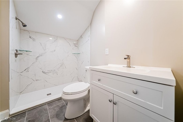 full bathroom featuring vanity, toilet, and a shower stall