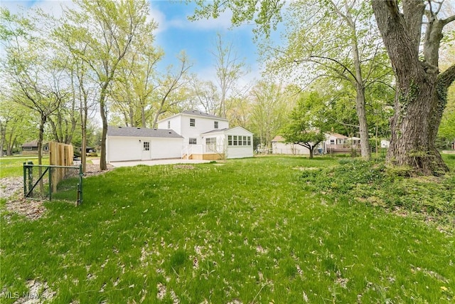view of yard featuring fence and a patio area