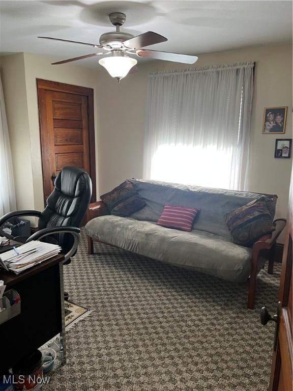 office area featuring ceiling fan and carpet