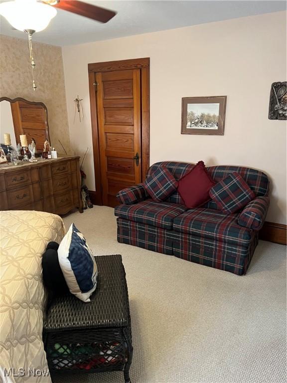 carpeted bedroom with ceiling fan