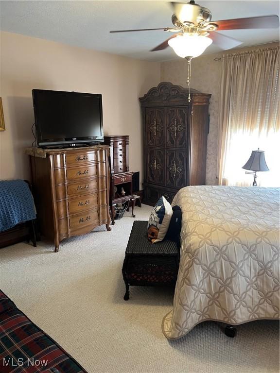 bedroom with carpet flooring and ceiling fan