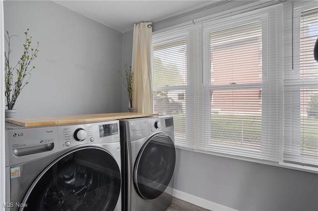 288 College St, Wadsworth, OH 44281 - washroom with washer and dryer, baseboards, and a wealth of natural light